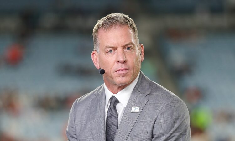 Troy Aikman wears a headset microphone at the broadcast position before the Bengals and Jaguars game.
