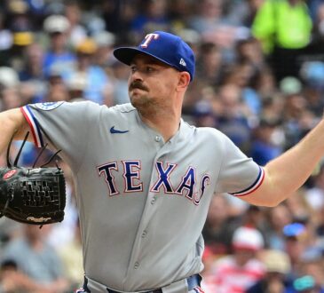 Texas Rangers left-hander Tyler Alexander, No. 13, comes set to deliver a pitch.