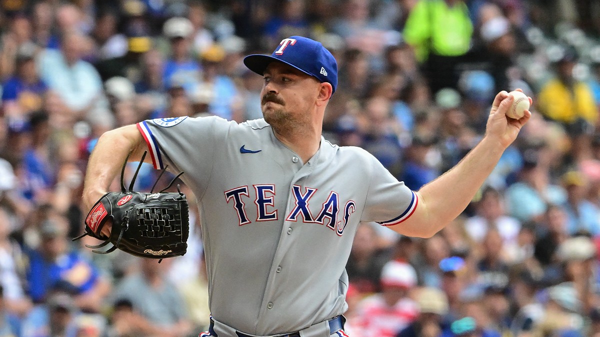 Texas Rangers left-hander Tyler Alexander, No. 13, comes set to deliver a pitch.