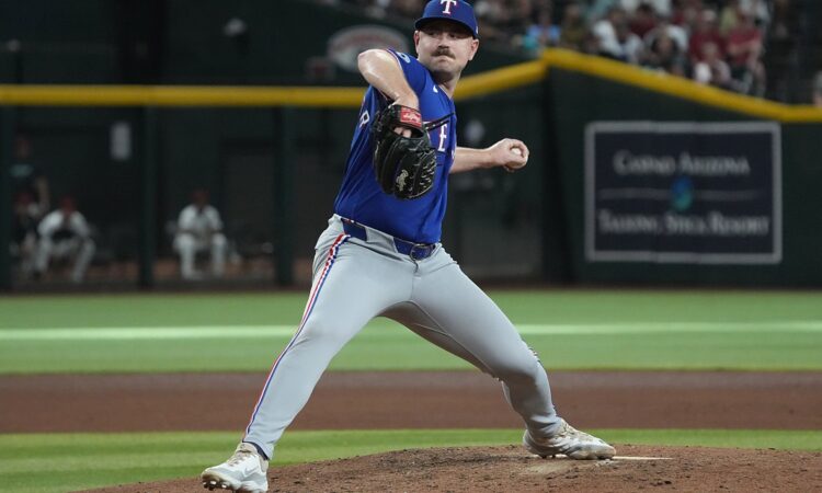 Texas Rangers pitcher Tyler Alexander delivers a pitch from the mound against Arizona at Chase Field.