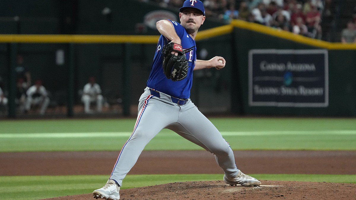 Texas Rangers pitcher Tyler Alexander delivers a pitch from the mound against Arizona at Chase Field.