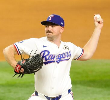 Rangers pitcher Tyler Alexander raises the ball behind him as he drives toward the plate.
