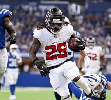 Falcons running back Tyler Goodson breaks past a diving Colts defender on his way into the end zone.