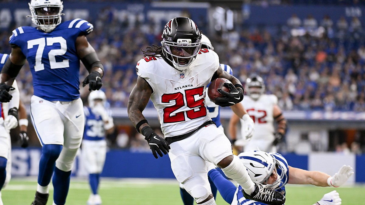 Falcons running back Tyler Goodson breaks past a diving Colts defender on his way into the end zone.