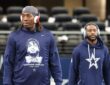 A Dallas Cowboys player in a memorial shirt honoring Marshawn Kneeland walks the field before the game against the Eagles.
