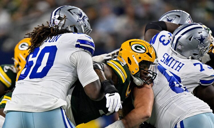 Dallas Cowboys offensive tackle Tyler Guyton blocks a Green Bay pass rusher at the line of scrimmage.
