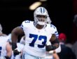 Dallas Cowboys offensive lineman Tyler Smith jogs out of the tunnel before the game against the San Francisco 49ers.