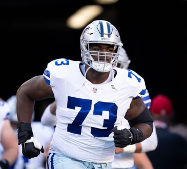 Dallas Cowboys offensive lineman Tyler Smith jogs out of the tunnel before the game against the San Francisco 49ers.