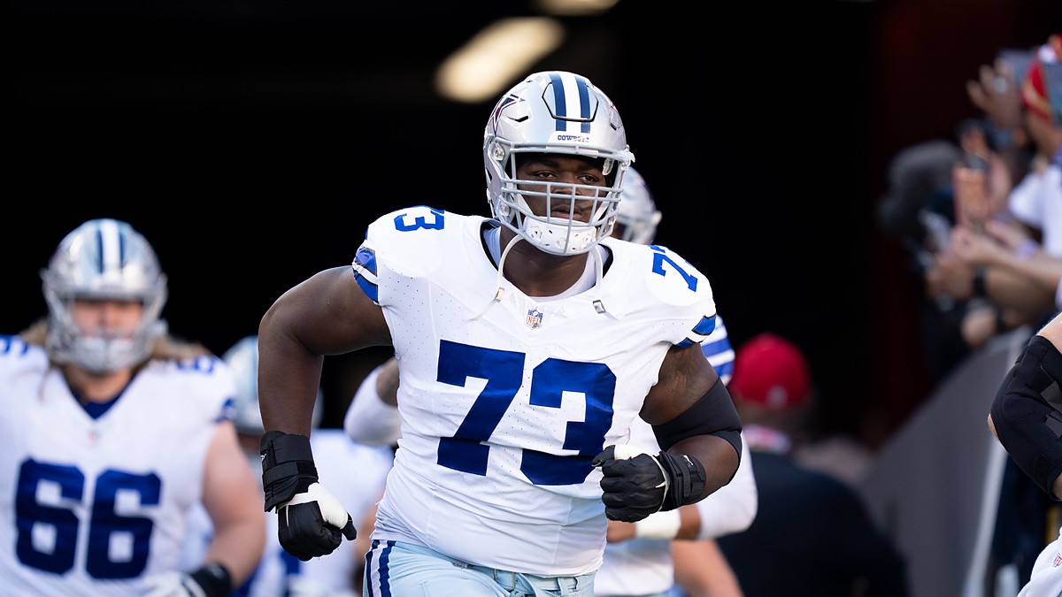Dallas Cowboys offensive lineman Tyler Smith jogs out of the tunnel before the game against the San Francisco 49ers.