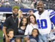 Dallas Cowboys linebacker Von Miller poses with his family on the field before a game at AT&T Stadium.