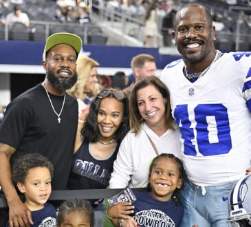 Dallas Cowboys linebacker Von Miller poses with his family on the field before a game at AT&T Stadium.