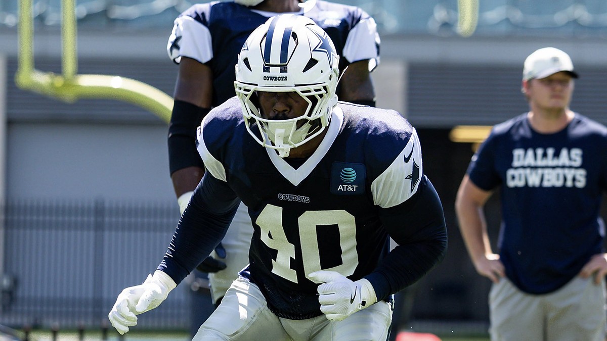 Dallas Cowboys outside linebacker Von Miller drops into a stance in a practice jersey during a team workout.