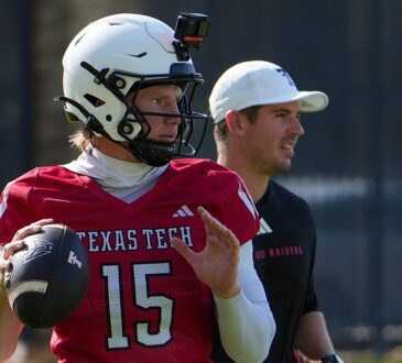 Texas Tech quarterback Will Hammond winds up to throw at practice as offensive coordinator Mack Leftwich watches.