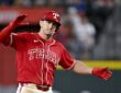 Texas Rangers left fielder Wyatt Langford celebrates with his arms out after hitting a double.