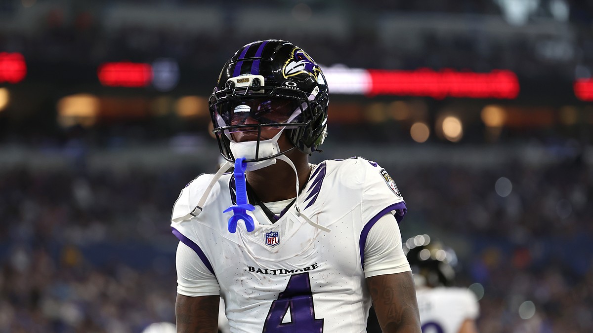 Baltimore Ravens wide receiver Xavien Flowers stands in the end zone with his mouthguard hanging from his face mask.