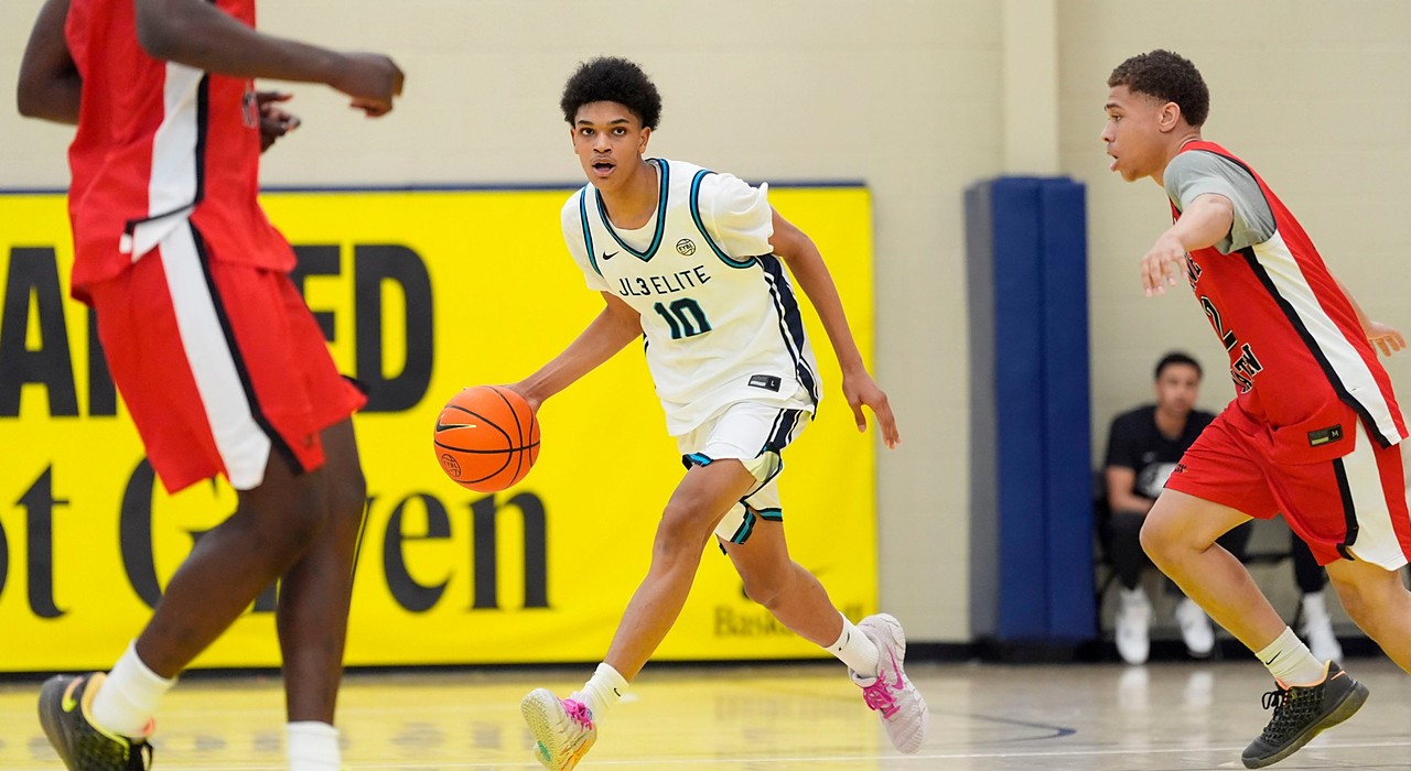JL3 guard Abdul-Malik Olajuwon dribbles up the court as a Drive Nation defender closes in.