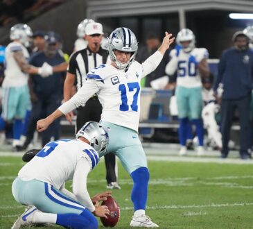 Dallas Cowboys kicker Brandon Aubrey plants his foot to kick as punter Bryan Anger holds the ball.