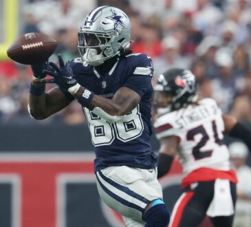 Dallas Cowboys wide receiver CeeDee Lamb (88) catching a football against the Houston Texans at Reliant Stadium in Houston, Texas.