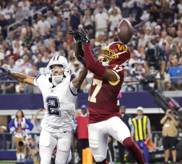 Dallas Cowboys cornerback Cobie Durant reaches to break up a pass in the end zone intended for Washington Commanders wide receiver Terry McLaurin.