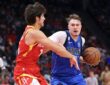 Dallas Mavericks forward Cooper Flagg drives with the ball in his right hand as Houston Rockets guard Reed Sheppard reaches in.