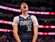 Mavericks forward Cooper Flagg screams and clenches his fists while celebrating