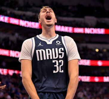 Mavericks forward Cooper Flagg screams and clenches his fists while celebrating