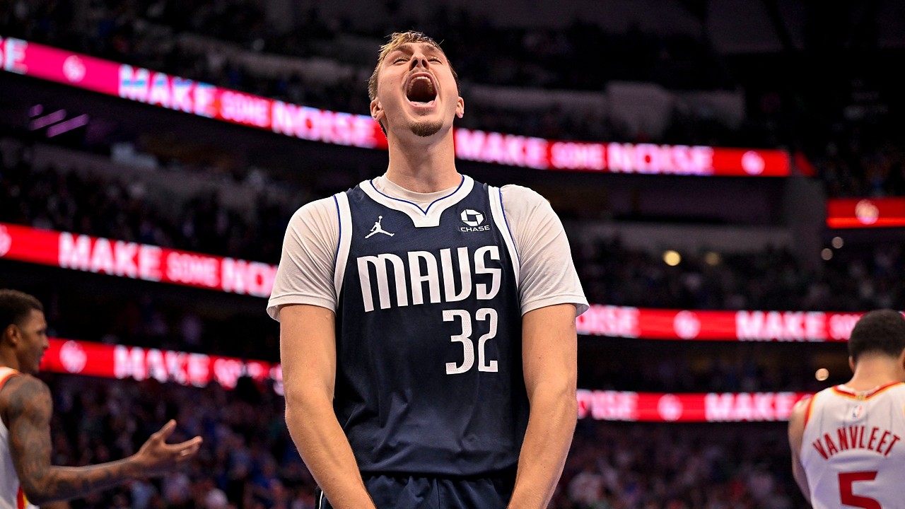 Mavericks forward Cooper Flagg screams and clenches his fists while celebrating