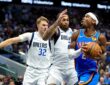 Mavericks forwards Cooper Flagg and P.J. Washington Jr. defend Thunder guard Shai Gilgeous-Alexander on a drive.