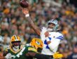 Dallas Cowboys quarterback Dak Prescott releases a pass as Green Bay Packers linebacker Zaire Franklin hits him.