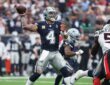 Cowboys quarterback Dak Prescott winds up to throw as Texans No. 51 rushes in from the right.