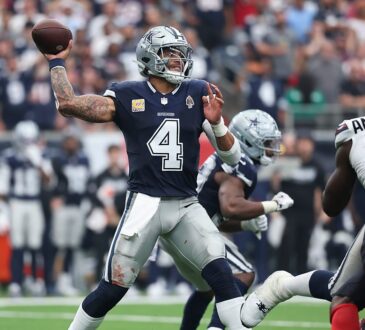 Cowboys quarterback Dak Prescott winds up to throw as Texans No. 51 rushes in from the right.