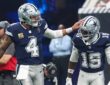 Cowboys quarterback Dak Prescott pats wide receiver Ryan Flournoy on the helmet after a score.