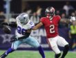 Cowboys cornerback DaRon Bland reaches for a loose pass in front of Buccaneers wide receiver Emeka Egbuka.