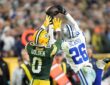 Dallas Cowboys cornerback DaRon Bland leaps to knock away a pass over Green Bay Packers wide receiver Matthew Golden.