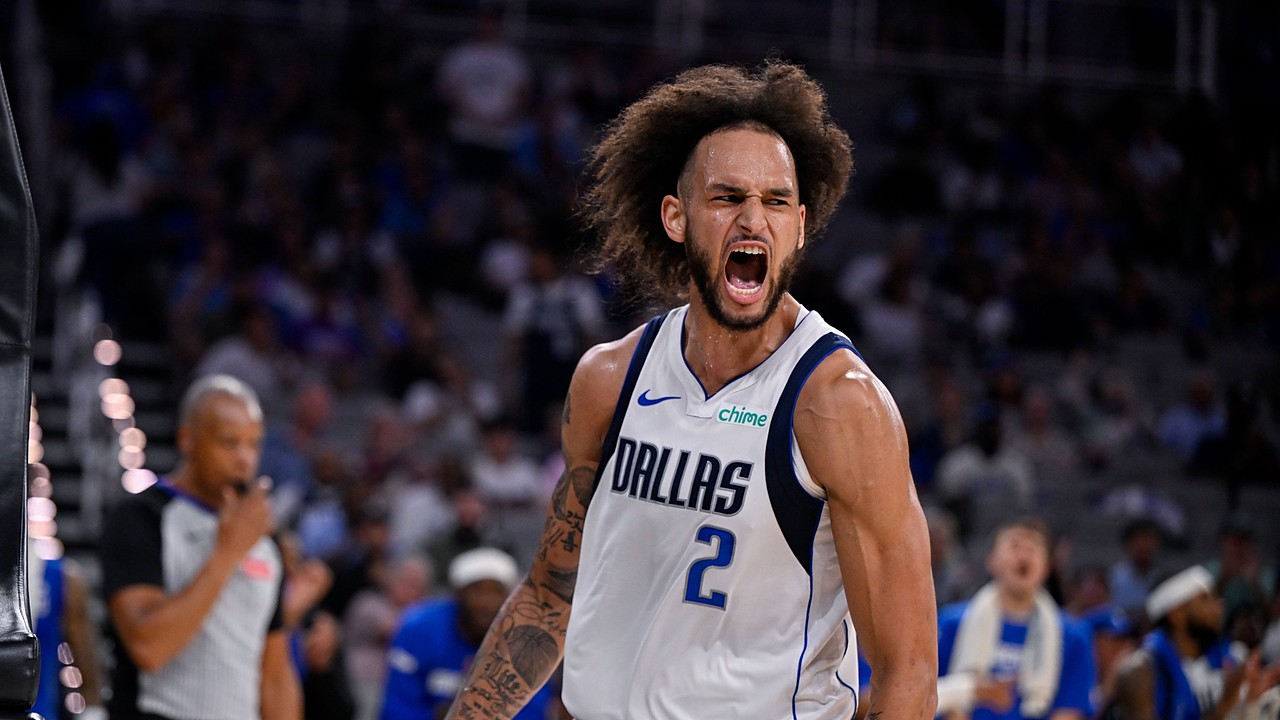 Mavericks center Dereck Lively II screams in celebration after a dunk.