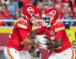 Then-Kansas City Chiefs running back Emari Demercado takes a handoff from quarterback Garrett Nussmeier.