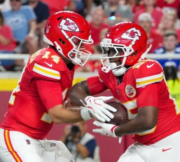 Then-Kansas City Chiefs running back Emari Demercado takes a handoff from quarterback Garrett Nussmeier.
