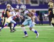 Cowboys linebacker Jaishawn Barham points as he backpedals into coverage with Saints players running routes nearby.