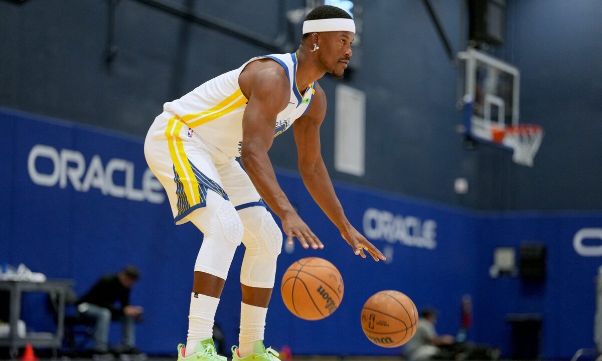 Golden State Warriors forward Jimmy Butler III #10 dribbles two basketballs during NBA Media Day at Chase Center.