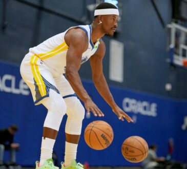 Golden State Warriors forward Jimmy Butler III #10 dribbles two basketballs during NBA Media Day at Chase Center.