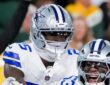 Dallas Cowboys cornerback Joey Porter Jr. joins the celebration as linebacker Dee Winters yells in front of him.