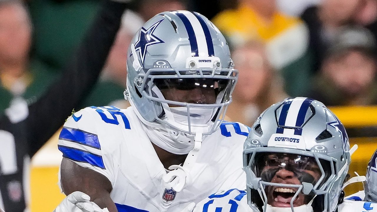 Dallas Cowboys cornerback Joey Porter Jr. joins the celebration as linebacker Dee Winters yells in front of him.