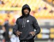 Then-Pittsburgh Steelers cornerback Joey Porter Jr. walks the field in a black hooded Steelers sweatshirt during pregame warmups.