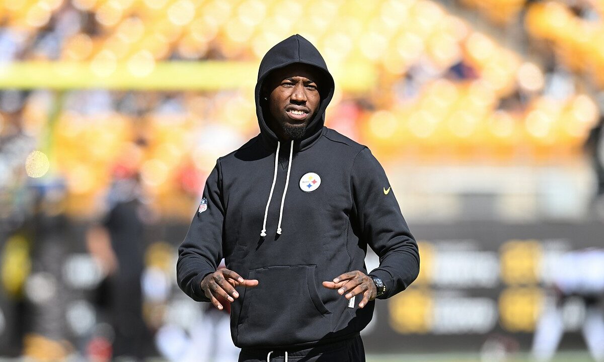 Then-Pittsburgh Steelers cornerback Joey Porter Jr. walks the field in a black hooded Steelers sweatshirt during pregame warmups.
