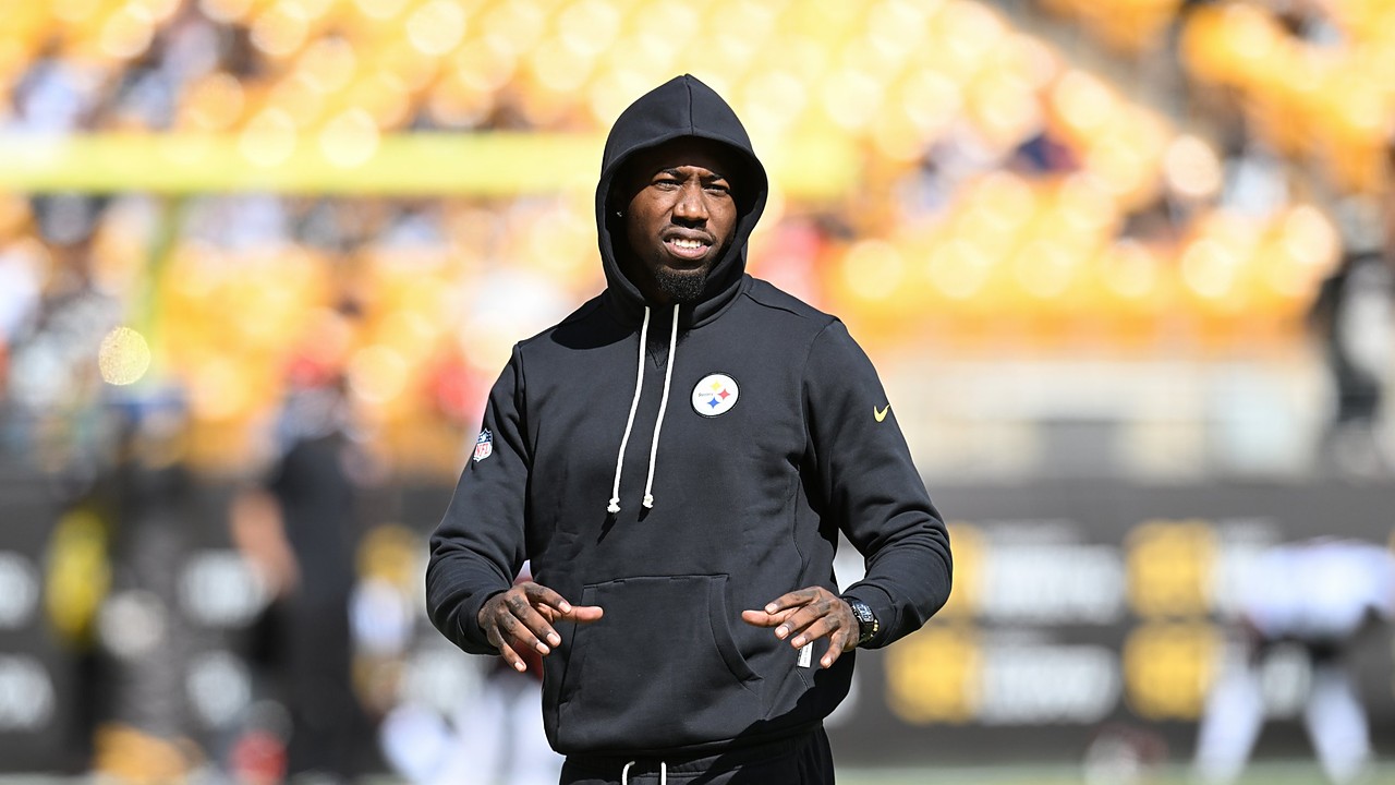 Then-Pittsburgh Steelers cornerback Joey Porter Jr. walks the field in a black hooded Steelers sweatshirt during pregame warmups.
