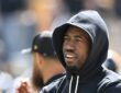 Pittsburgh Steelers cornerback Joey Porter Jr. stands with his arms crossed in a black team hoodie during pregame warm-ups.