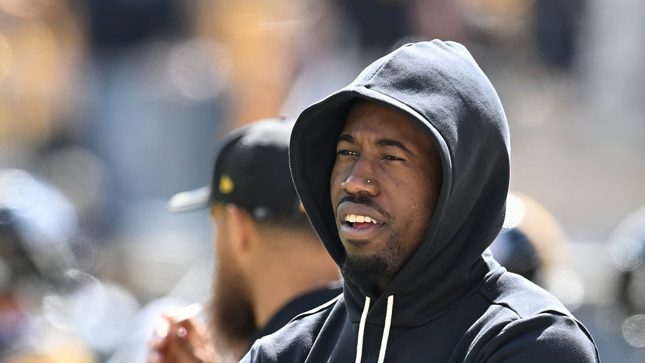 Pittsburgh Steelers cornerback Joey Porter Jr. stands with his arms crossed in a black team hoodie during pregame warm-ups.