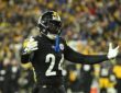 Pittsburgh Steelers cornerback Joey Porter Jr. spreads his arms wide while reacting on the field.