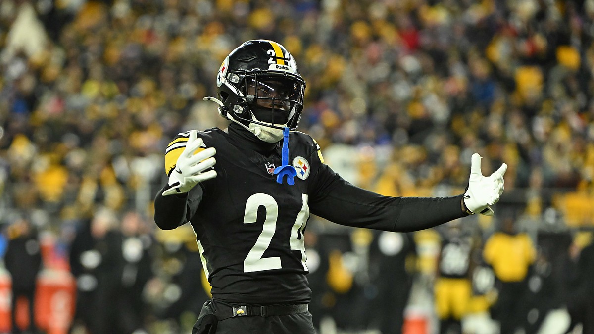 Pittsburgh Steelers cornerback Joey Porter Jr. spreads his arms wide while reacting on the field.