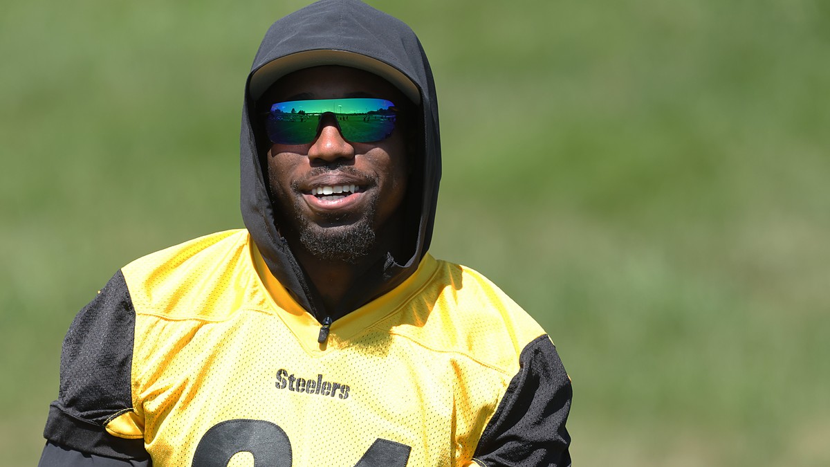 Pittsburgh Steelers cornerback Joey Porter Jr. smiles in sunglasses and a hood while watching practice.